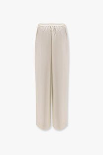 Rohe women’s jogger silk trousers white with cream-colored wide-leg flowing fabric and elastic waistband front view