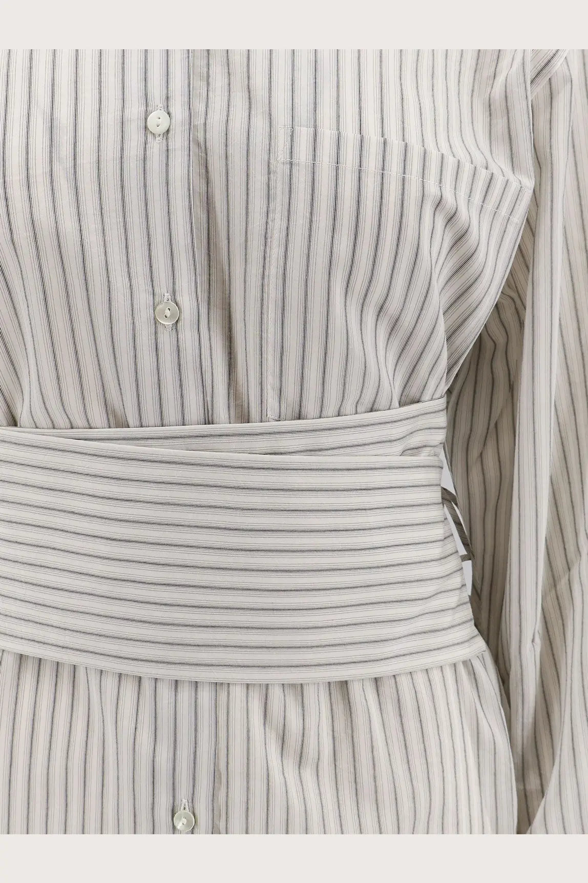 A fitted long-sleeved light and dark gray pinstripe dress with matching belt in silk and cotton blend by Rohe women