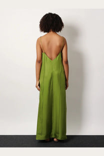 Rohe women’s silk dress green showing back side featuring a flowing olive green satin maxi with thin straps and deep cutout