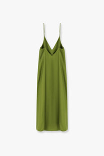 A sleek olive green silk slip dress with thin spaghetti straps and a deep v-neckline from Rohe women’s collection