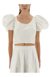 White cropped cotton blouse with puff sleeves and floral embroidery from rotate birger christensen women’s collection