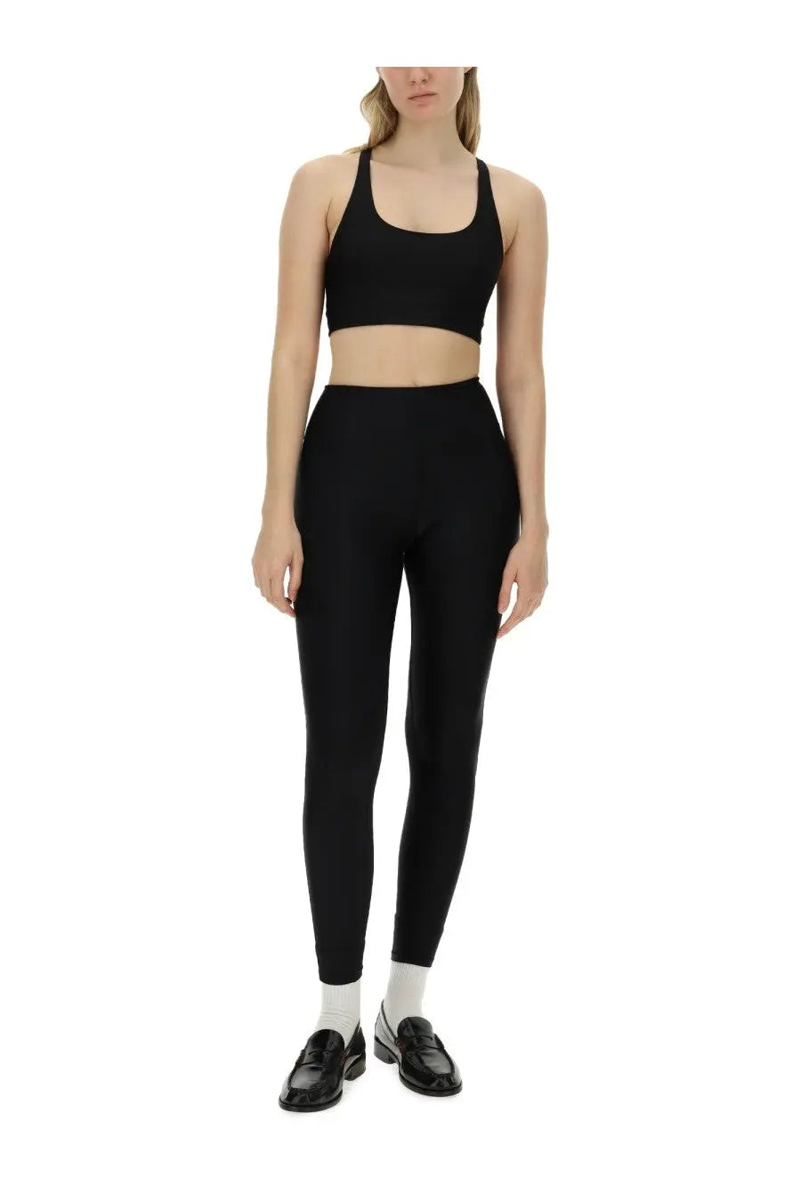 Black high-waisted leggings with smooth form-fitting stretch fabric for rotate birger christensen women’s crop top black
