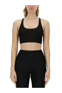 Black seamless sports bra with wide shoulder straps and scoop neckline from rotate birger christensen womens crop top