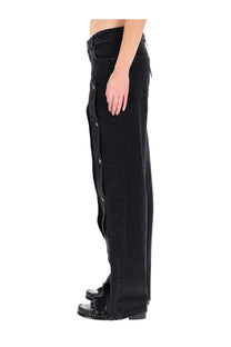Black denim trousers by Rotate Birger Christensen with a vertical buttoned slit down the side for women