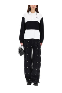 Rotate Birger Christensen women’s black denim wide-leg jeans with silver-toned buttons along outer seams