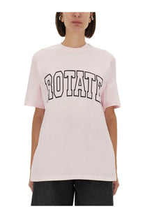 A soft pink oversized crewneck jersey t-shirt with bold black outlined rotate lettering by Rotate Birger Christensen