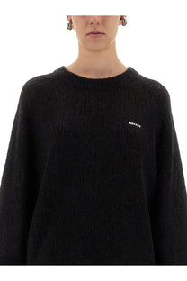 Rotate Birger Christensen women’s lightweight black knit sweater with subtle texture and white rotate logo on left chest