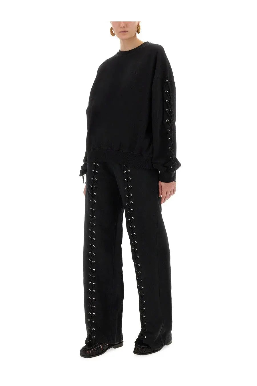 Rotate birger christensen women’s black sports pants with silver eyelets and matching black lace-up sweatshirt with ruffled cuffs