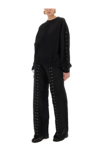 Rotate birger christensen women’s black sports pants with silver eyelets and matching black lace-up sweatshirt with ruffled cuffs