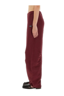 Maroon wide-leg terry sweatpants with elastic waistband and black brand tag from Rotate Birger Christensen women sports pants