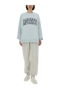 Light blue oversized Rotate Birger Christensen women’s sweatshirt with bold black rotate lettering on the chest