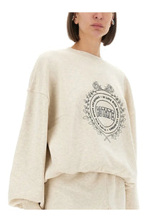 Beige oversized rotate birger christensen women’s sweatshirt with black embroidered rose design on front