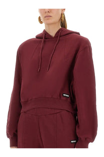 Rotate Birger Christensen women’s red terry back cropped hoodie with ribbed waistband and black rotate brand labels