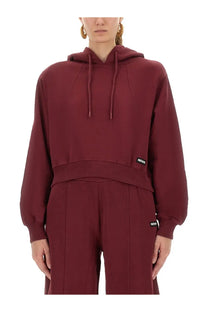Rotate birger christensen women’s maroon terry back cropped hoodie with ribbed waistband and drawstrings from back