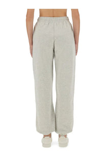 Rotate Birger Christensen women’s track pants in light gray heathered fabric with elastic waistband and relaxed straight-leg cut