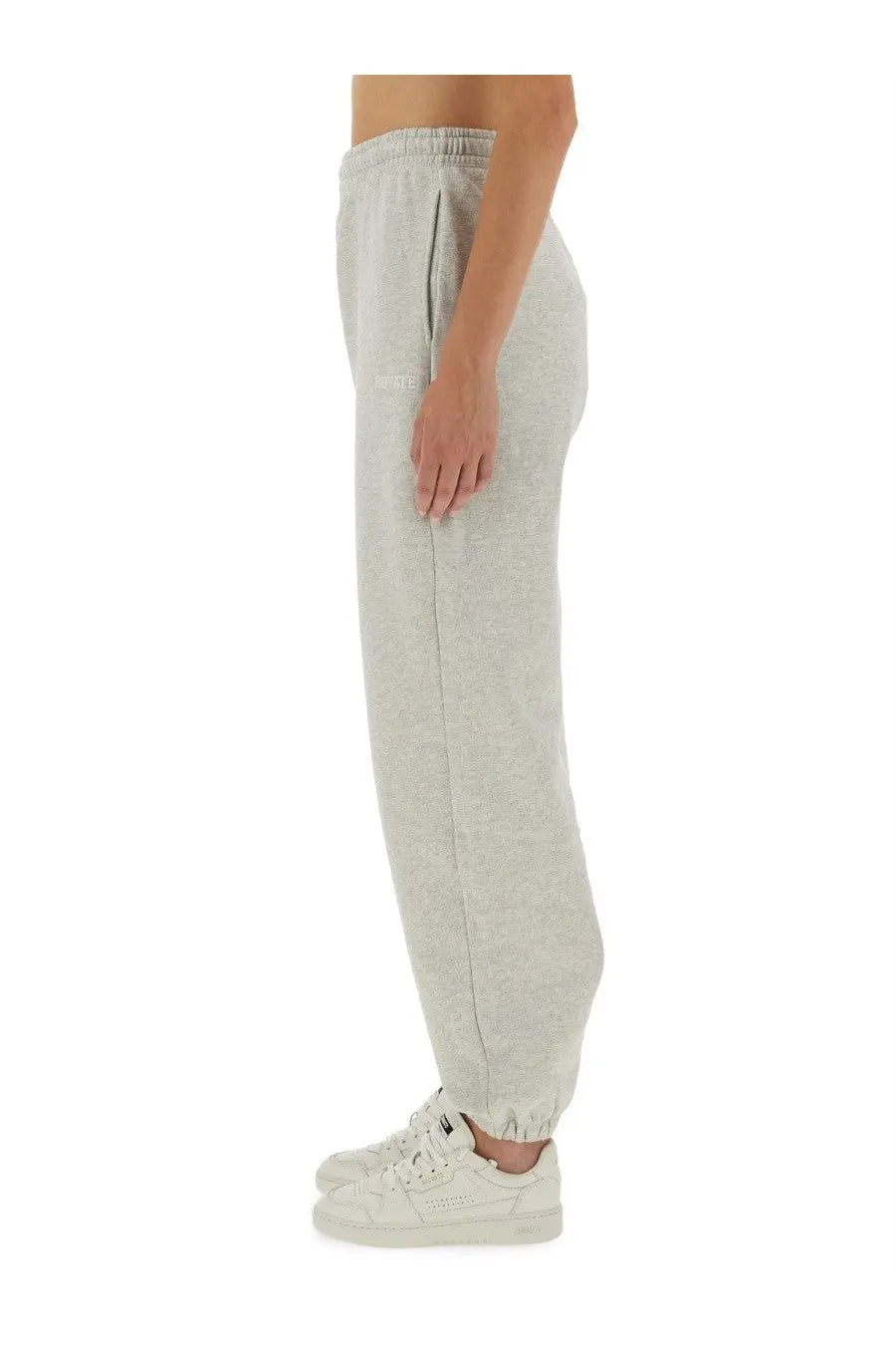 Light gray heathered Rotate Birger Christensen women’s track pants with relaxed fit and elastic cuffs