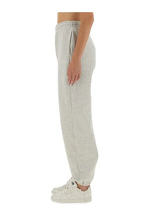 Light gray heathered Rotate Birger Christensen women’s track pants with relaxed fit and elastic cuffs