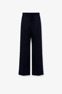Black wide-leg wool trousers by the row with sleek tailored design and subtle creases for women