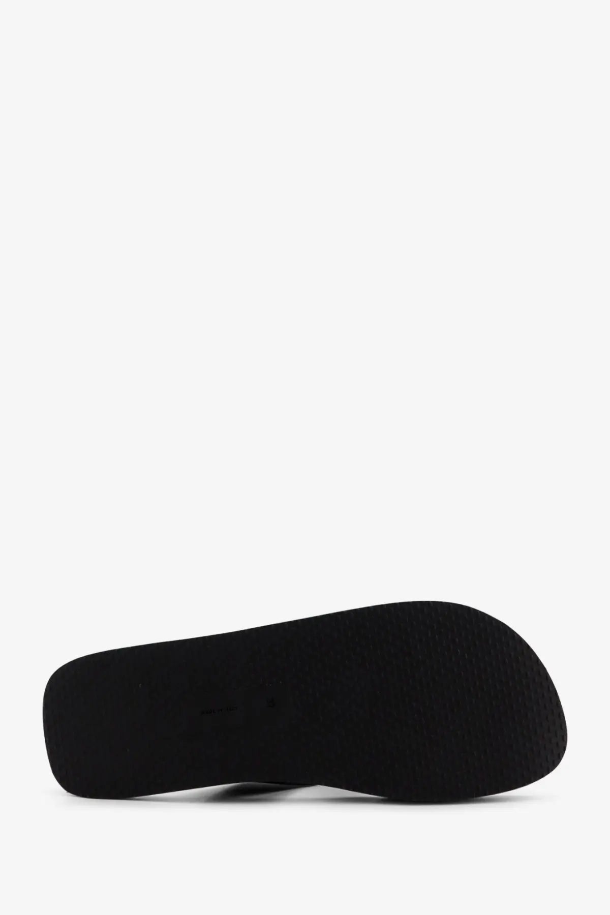 Black rubber sole with textured surface of the row women’s dune classic ginza leather sandals black back view
