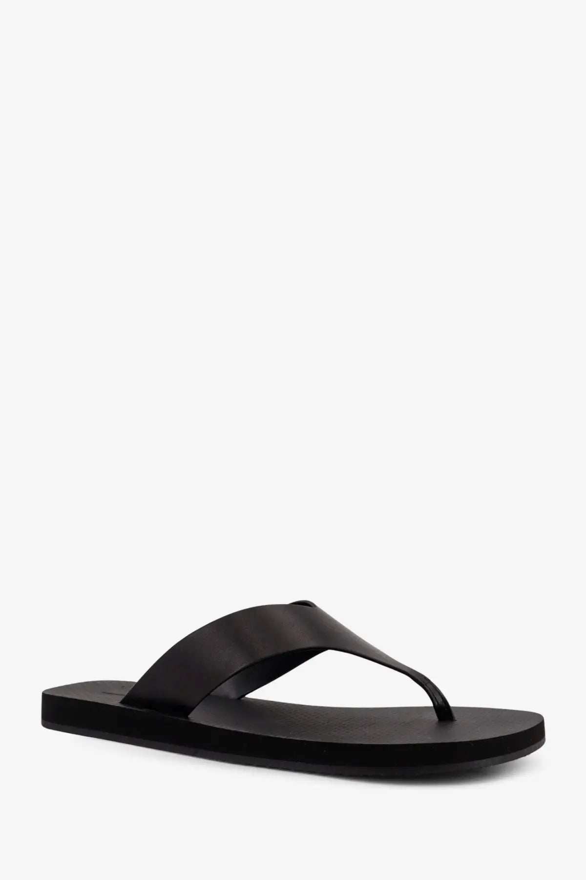 Black leather thong sandal with a sleek minimalist design from The Row women’s Dune Classic Ginza collection