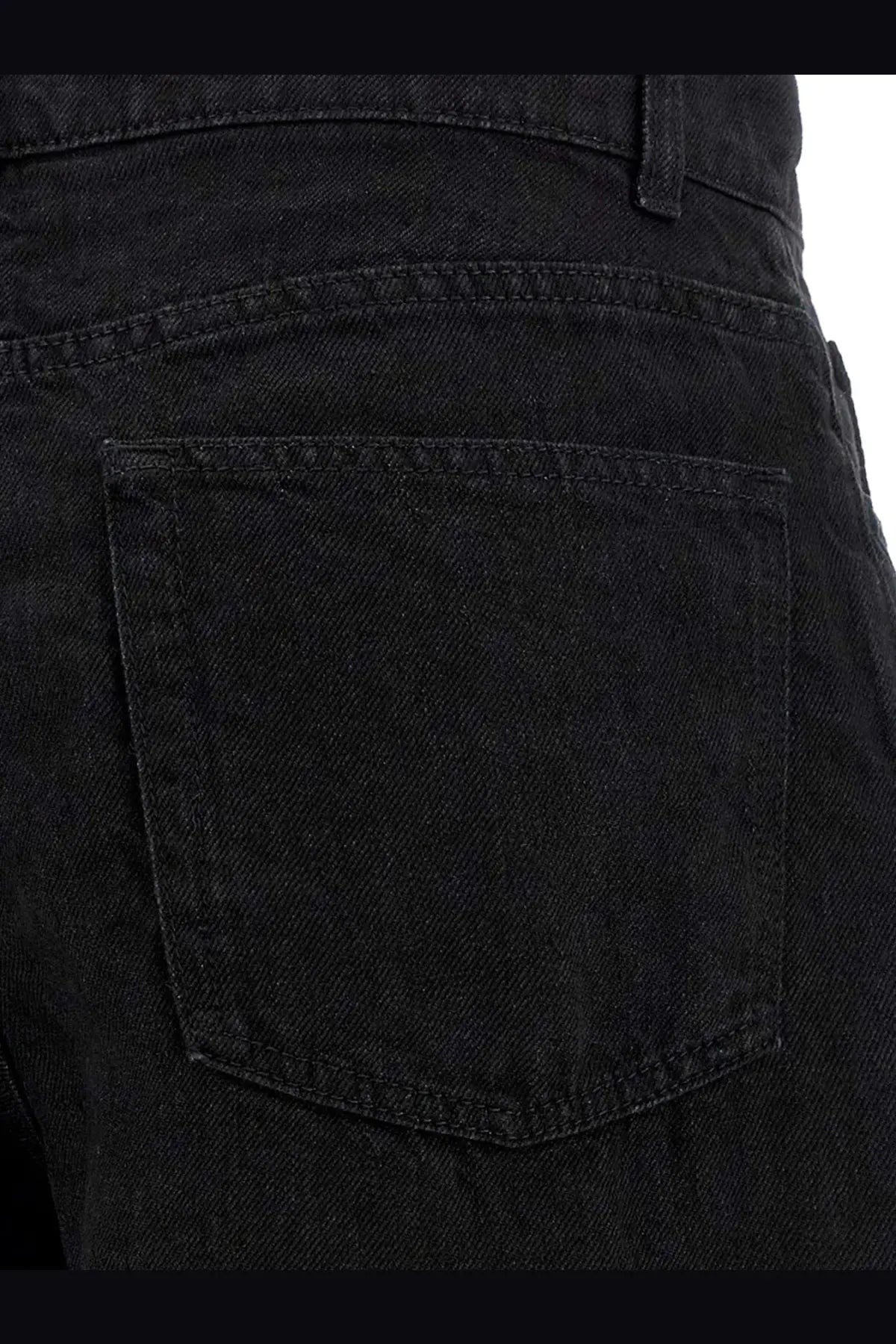 The back side of The Row women’s Eglitta black linen trousers showing classic black denim pocket design