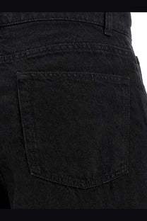The back side of The Row women’s Eglitta black linen trousers showing classic black denim pocket design