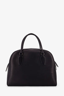 The Row womens India black leather handbag with structured dome shape and top handles satchel design