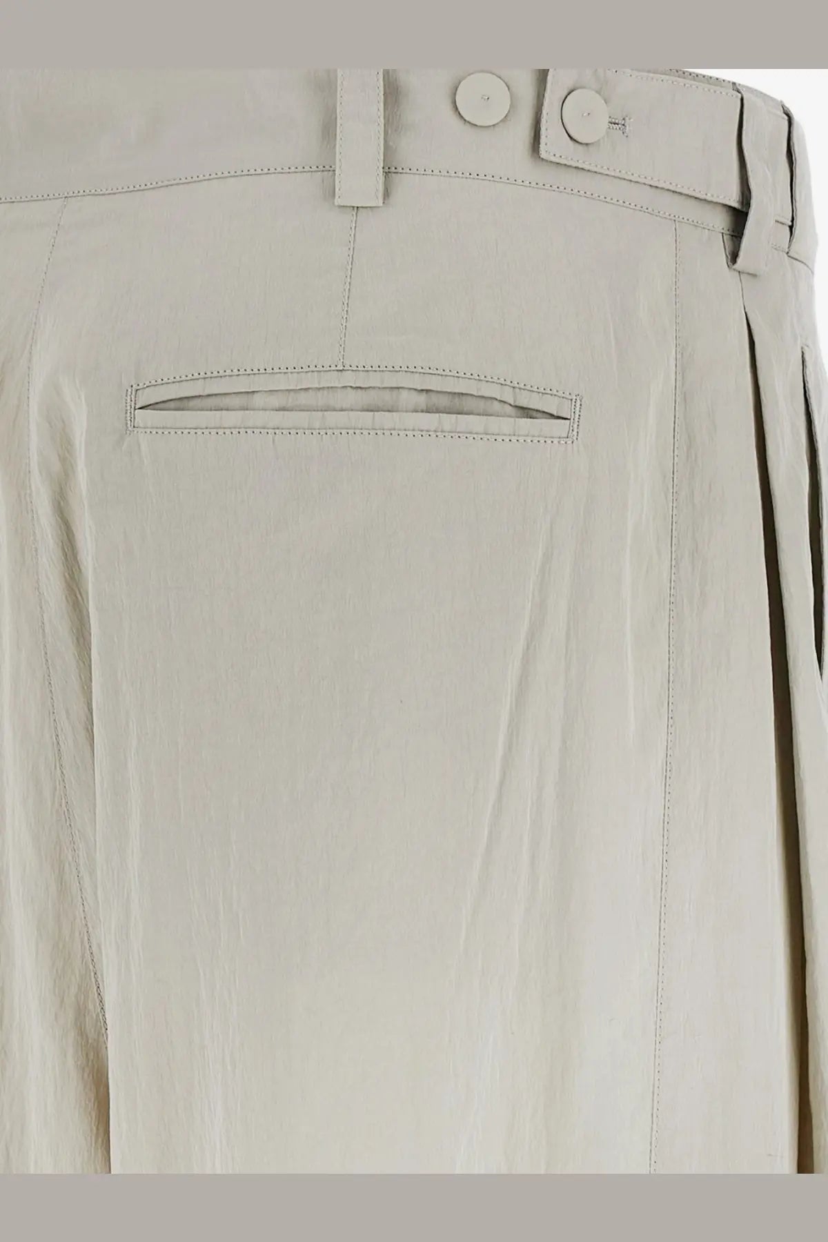 Beige linen trousers with buttoned waistband and subtle stitching details from the row womens iven silk and nylon trousers gray