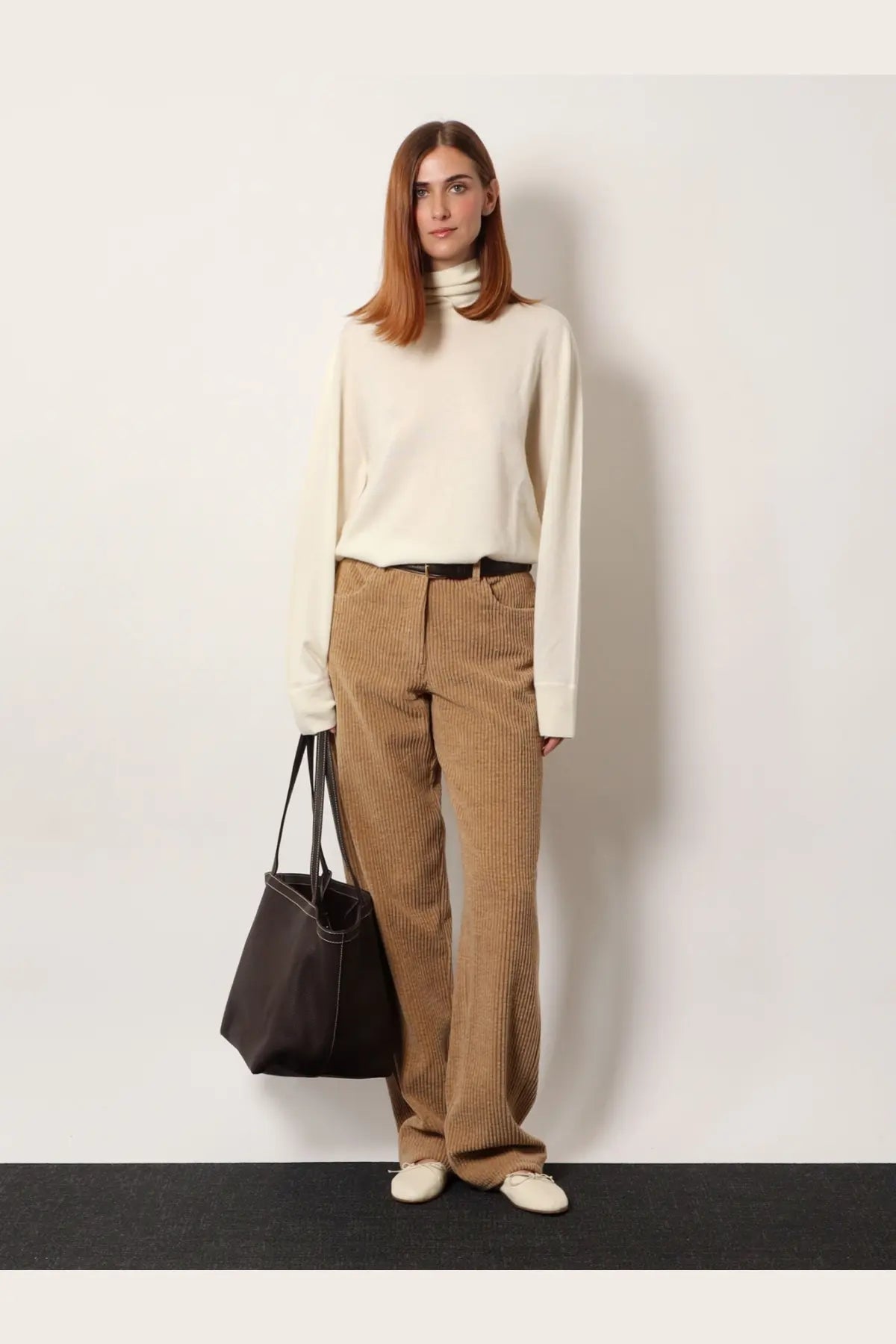 The Row women’s Lizzy cashmere top white cream-colored long-sleeved turtleneck sweater with soft knit texture