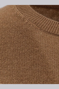 A cozy camel-colored cashmere knit sweater by the row with ribbed crew neckline and fine uniform stitching