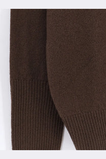 The row women’s odelle top cashmere sweater brown showing brown knitted sleeve with ribbed cuffs
