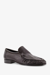 The Row women’s soft mocassin two black leather slip-on loafer with frayed ruffled detail along the toe