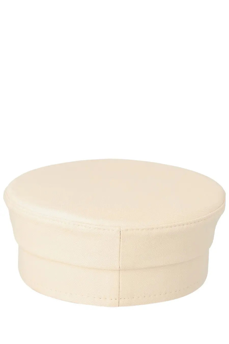 Cream-colored round ottoman with soft padded top and stitched seams shown with ruslan baginskiy women’s baker boy hat beige