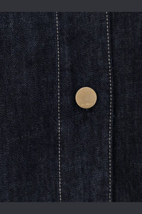 A gold-toned circular button engraved on blue denim fabric of s max mara womens denim shirt