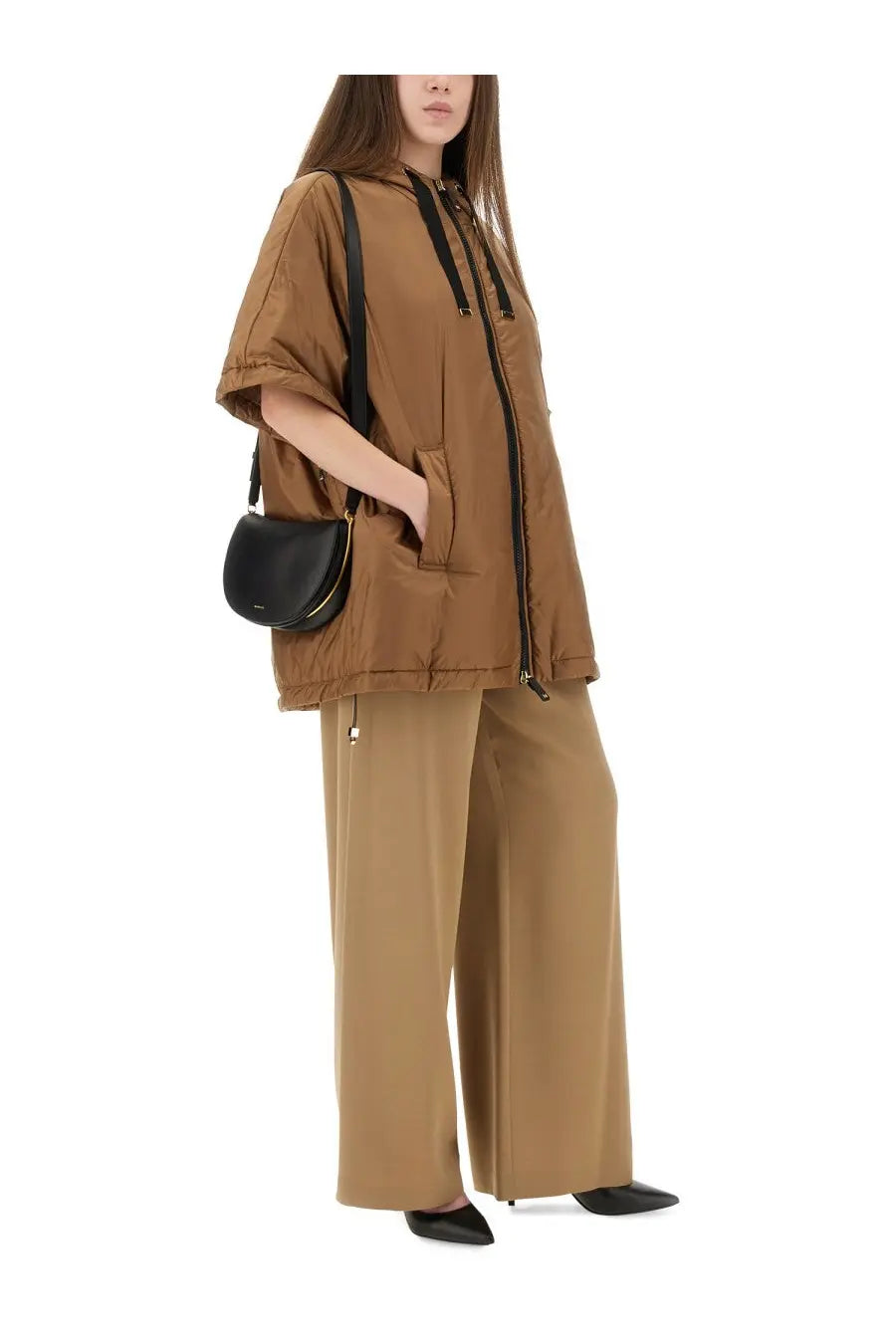 Black leather crossbody bag with gold zipper detail paired with s max mara women’s greenci beige padded jacket