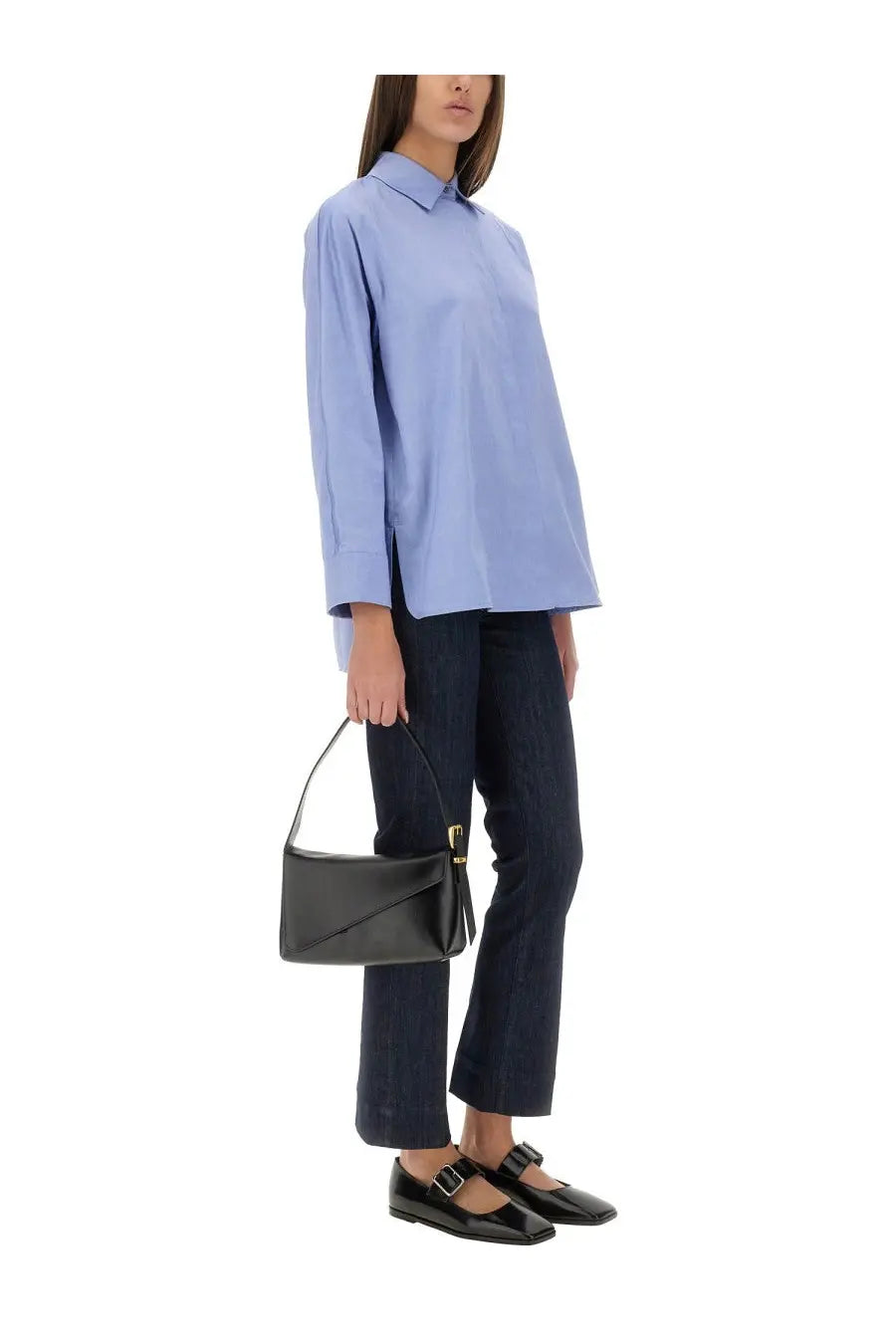 Black leather mini handbag with structured envelope shape and gold-tone hardware paired with s max mara uberti blue jeans