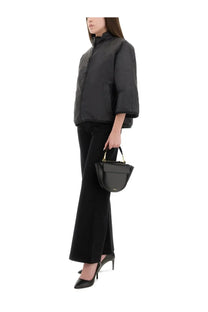Black leather half moon handbag with gold hardware featured with s max mara women’s quilted jacket delfina black
