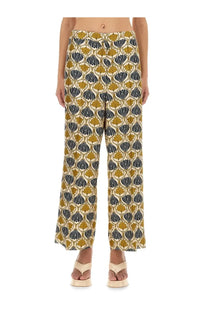 S Max Mara women’s silk wide-leg trousers with bold mustard yellow and navy blue leaf pattern on cream fabric