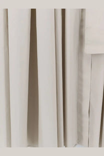 Off-white pleated cotton fabric curtain with smooth textured surface and neat vertical seams for max mara dress ghiaccio