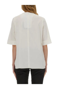 Back view of s max mara women’s white blouse with short sleeves and central back seam in minimalist design