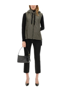 Black leather mini handbag with structured angular design and gold-tone hardware paired with s max mara grey waterproof vest