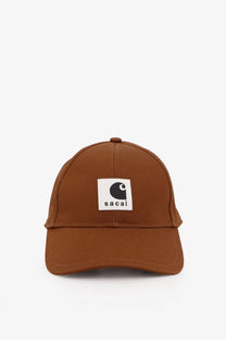 Beige sacai men’s carhartt wip duck cotton baseball hat with a brown cap and white patch featuring black sacai logo