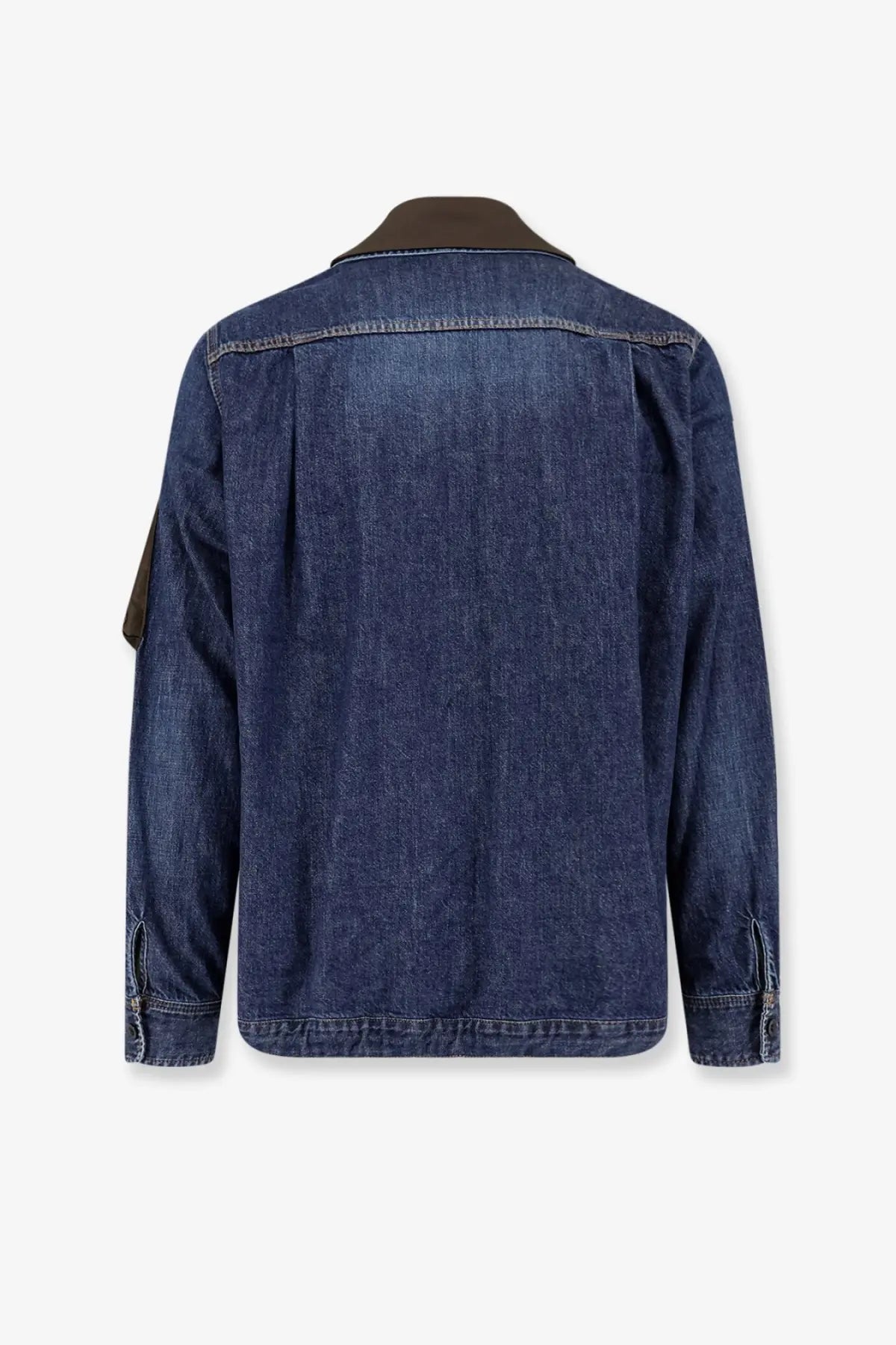 Sacai men’s blue denim jacket with dark blue fabric, contrasting brown collar, and brown sleeve patch