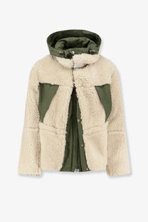 Sacai men’s eco shearling and nylon jacket in cream with olive green panels and matching hood