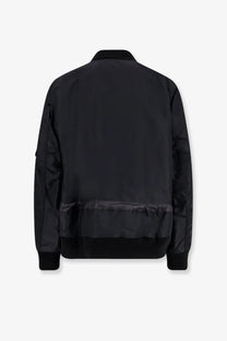 Sacai men’s black nylon bomber jacket with sleek matte finish and subtle ribbed cuffs in front view