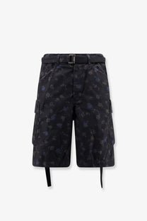 Sacai men’s printed cotton shorts in black with dark blue floral cargo design side ties and matching belt