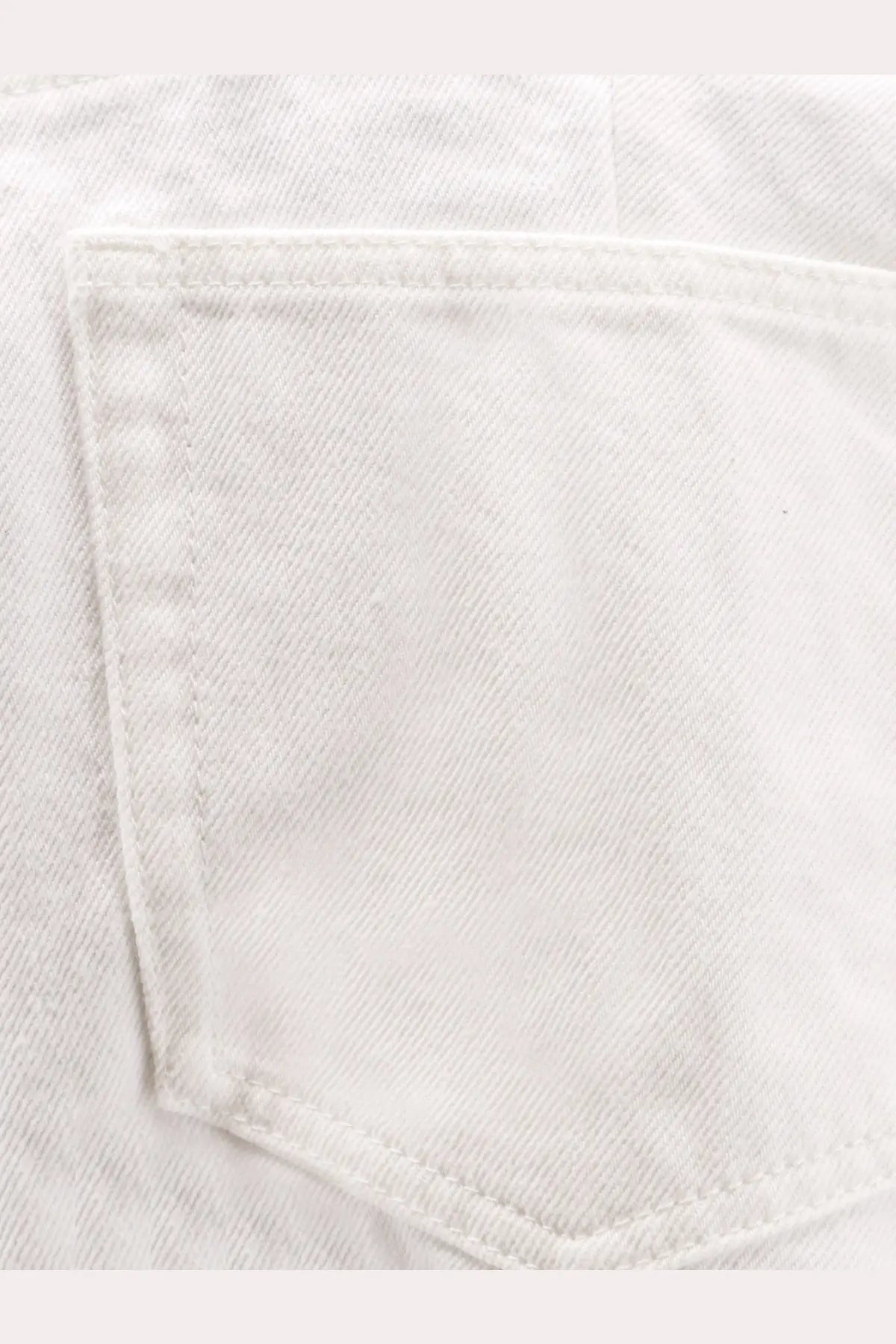 Sacai women’s white cotton shorts with a back white denim pocket featuring visible stitching and faded texture