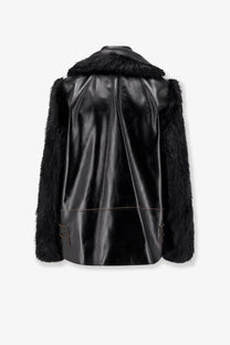 Sacai women’s black leather jacket with plush fur trim on collar and sleeves for stylish outerwear look