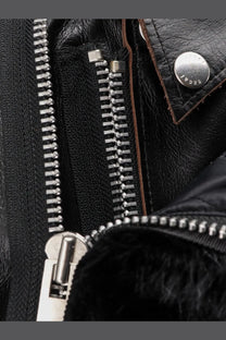 Sacai women’s black leather jacket with silver zippers and branded metal snap button detail