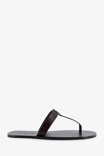 Saint Laurent men’s babylone leather sandals in dark brown with minimalist thong design and black sole viewed from the back